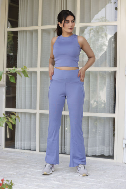 A stylish and versatile powder blue co-ord set featuring a sleeveless top and high-waisted flared leggings. Crafted from premium Lycra, this set offers a sleek, form-fitting silhouette with moisture-wicking technology, making it perfect for workouts, yoga, or casual outings. The flared leggings provide a flattering fit, while the sleeveless top ensures breathability and comfort