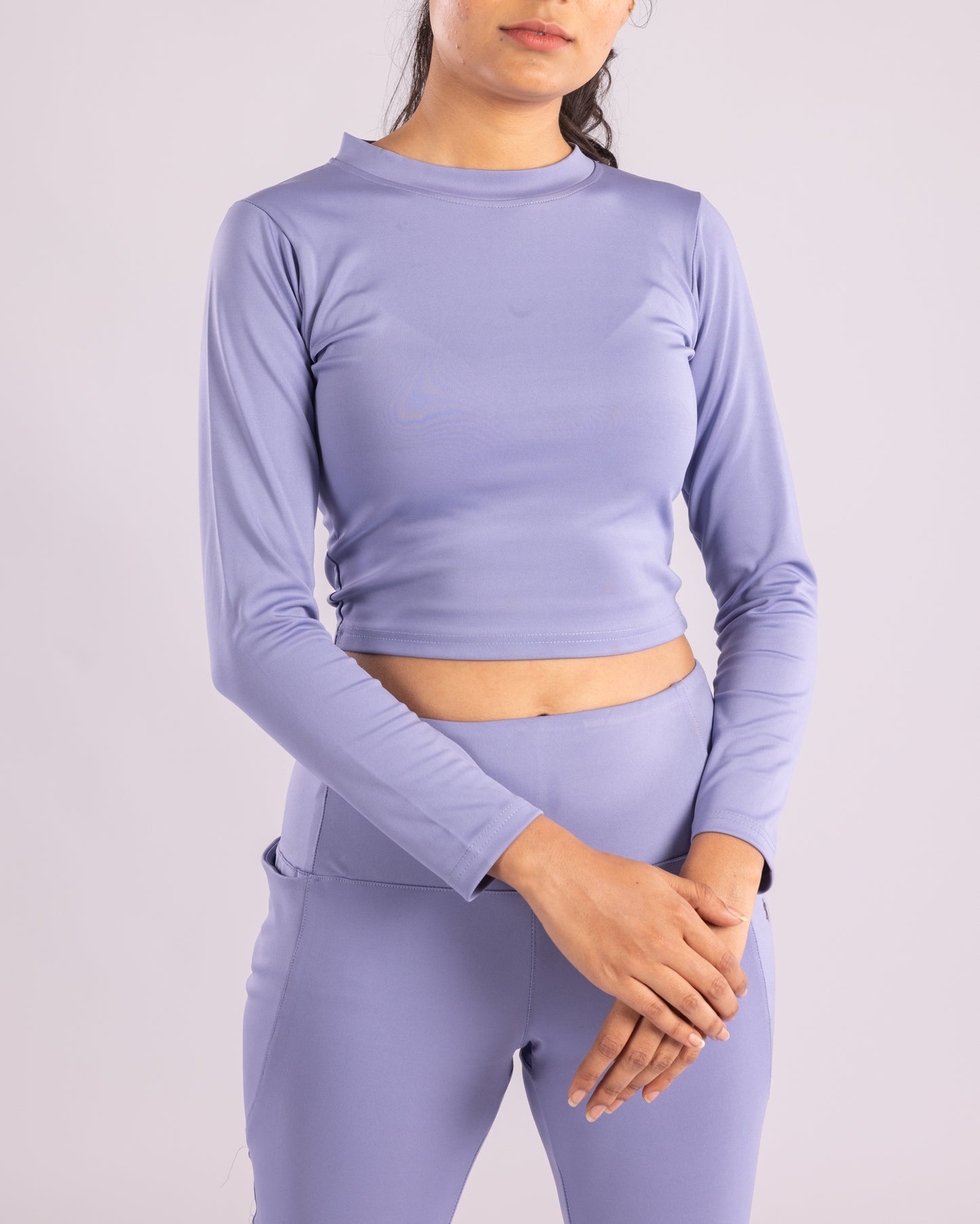 Seamless Powder Blue full sleeve crop top for women’s gym wear, designed with breathable, sweat-wicking, and ultra-stretch Lycra fabric. Body-hugging fit for training, running, yoga, and active lifestyle. Lightweight, flexible, and stylish workout top