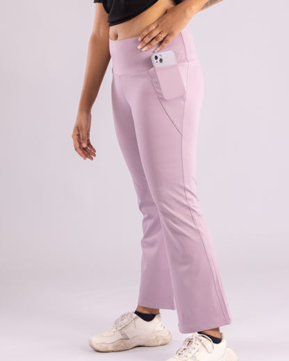 High-waisted lavender flared trousers for women, designed with a flattering silhouette, superior stretch, and ultra-soft Lycra fabric for all-day comfort. Sweat-wicking and breathable for intense workouts, yoga, running, and athleisure wear. Trendy, stylish, and functional gym leggings with flare-bottom styling for a fashionable sporty look