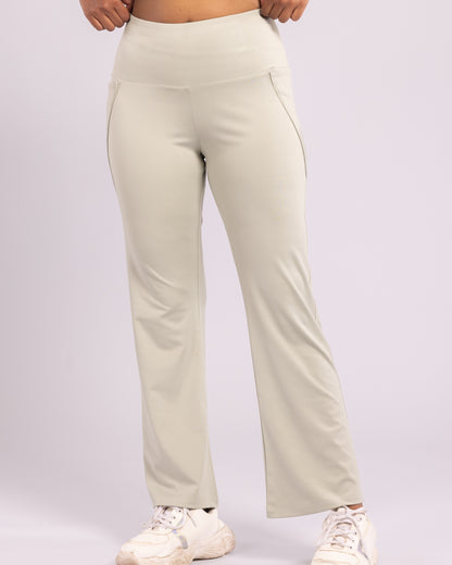 High-waisted sage green flared trousers for women, crafted from premium Lycra for a flattering fit, sweat-wicking comfort, and ultra-soft stretch. Ideal for workouts, yoga, and everyday athleisure wear