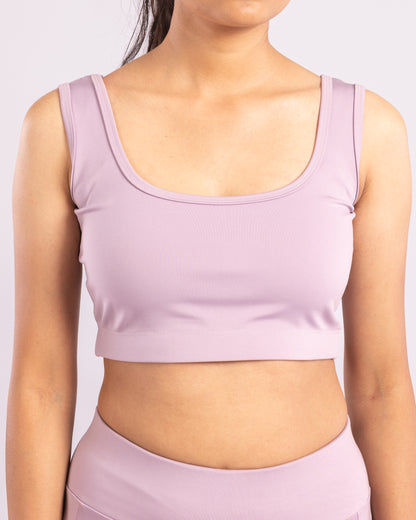 Lavender sleeveless crop top for women, designed for a snug, form-fitting look with flexible Lycra material for maximum stretch and movement. Ideal for gym workouts, yoga, running, and activewear. Moisture-wicking, lightweight, and breathable fabric enhances comfort while providing a chic, athletic aesthetic for daily athleisure wear