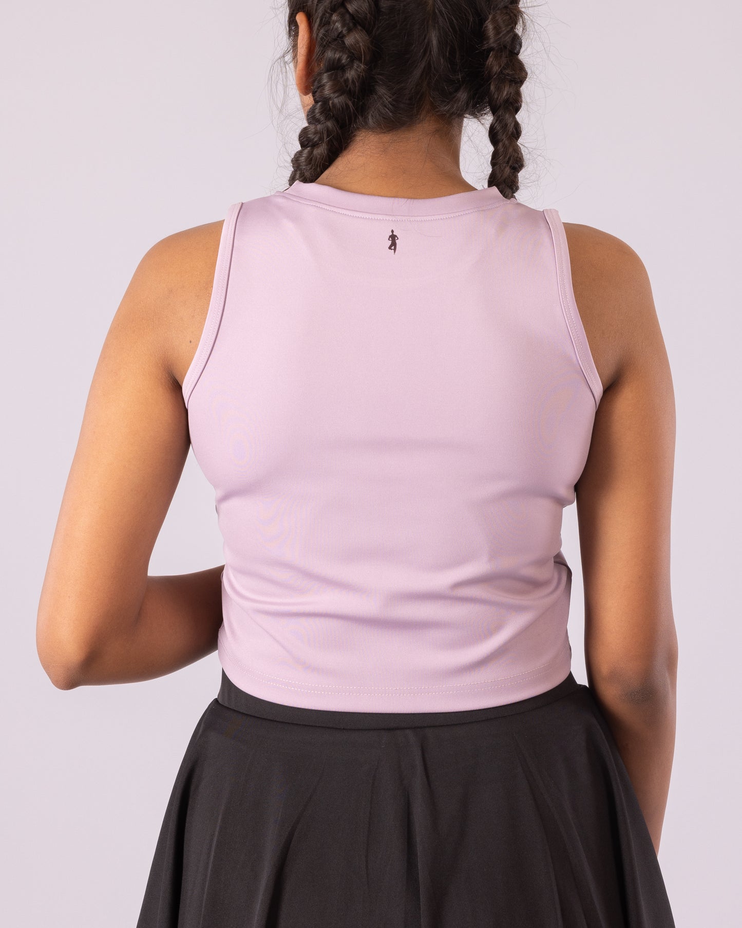 Lavender sleeveless crop top for women, designed for a snug, form-fitting look with flexible Lycra material for maximum stretch and movement. Ideal for gym workouts, yoga, running, and activewear. Moisture-wicking, lightweight, and breathable fabric enhances comfort while providing a chic, athletic aesthetic for daily athleisure wear