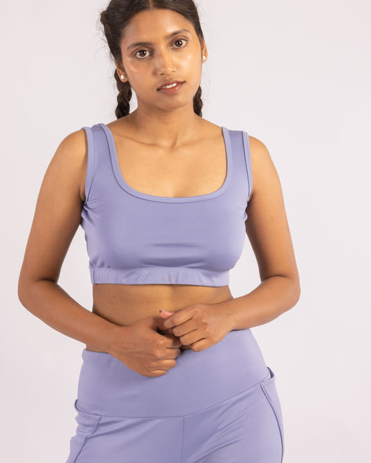 Powder blue sleeveless crop top made from premium Lycra, offering a snug yet flexible fit. Designed with moisture-wicking technology, this top provides comfort, breathability, and a sleek, form-fitting silhouette—perfect for workouts or casual wear.