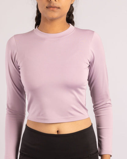 Lavender full sleeve crop top for women, tailored for a sleek, body-hugging fit with breathable, sweat-wicking Lycra fabric. Perfect for high-intensity training, yoga, running, and stylish athleisure wear. Offers excellent stretchability, durability, and a soft-touch feel for a comfortable, second-skin experience during workouts or casual outings.