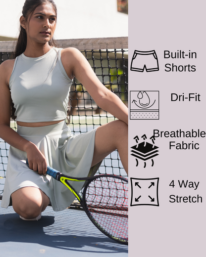 Women's sage green tennis skort and crop top set, high-waisted athletic skort with built-in shorts, and a fitted sleeveless crop top, crafted from premium moisture-wicking Lycra for gym, yoga, running, and casual wear.